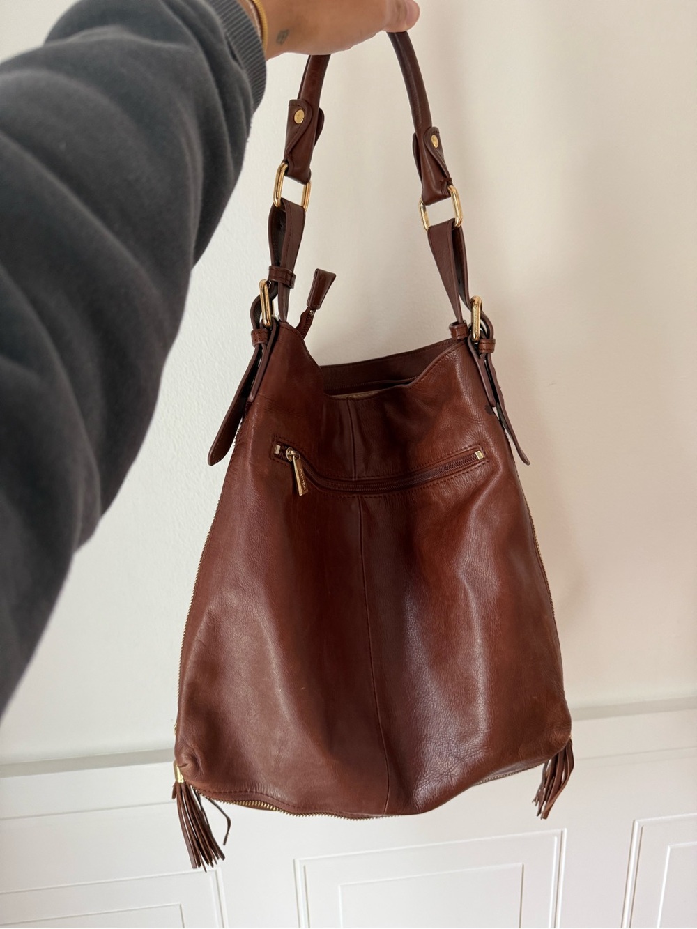 Danier Brown Leather Hobo Bag with Tassel Accents